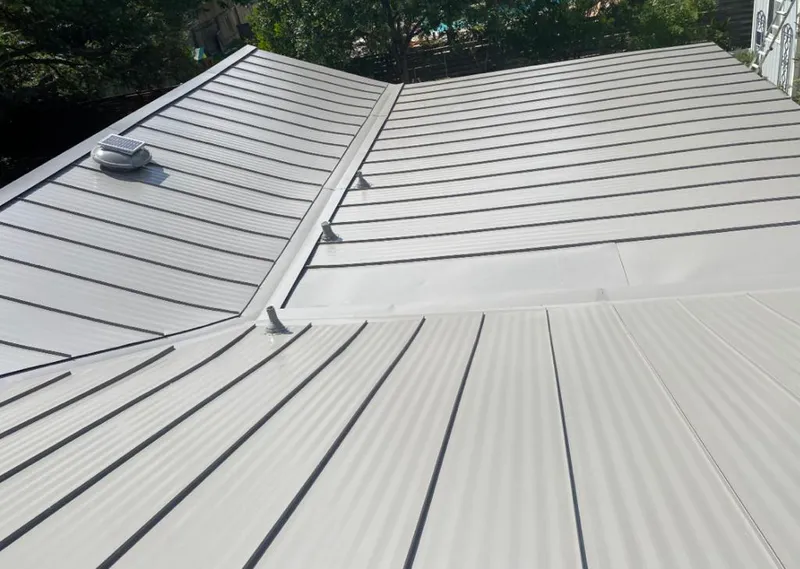 Solar attic fan installed on a metal roof for Roof Ventilation in Ventnor City